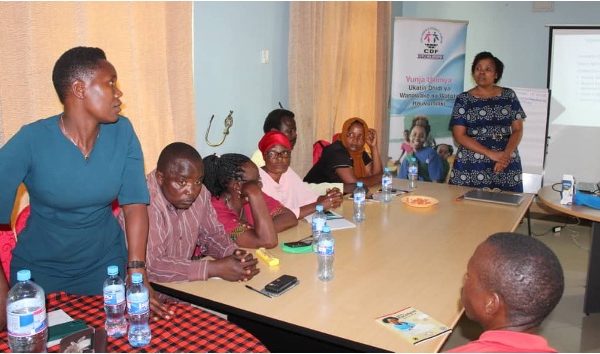Bigile (first left, standing) during the CHWs training conducted in Tarime District