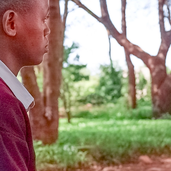 Alt text: Siwema, 16, a student in Mpwapwa, Tanzania, supported by Children's Dignity Forum, staying in school despite menstrual challenges.